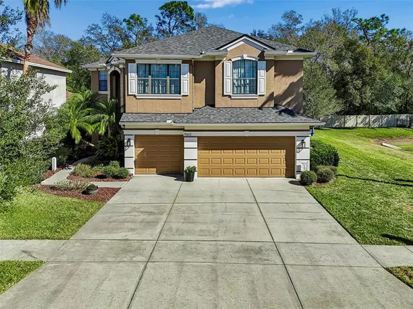 a view of a house with a yard