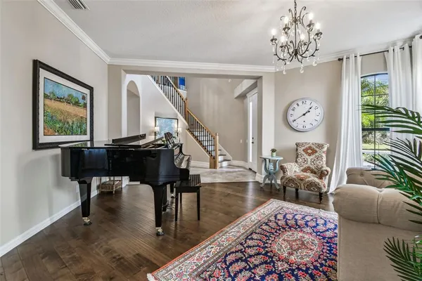 a view of a dining room with furniture and wooden floor