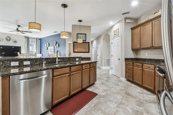 a view of a hallway with wooden floor and closet