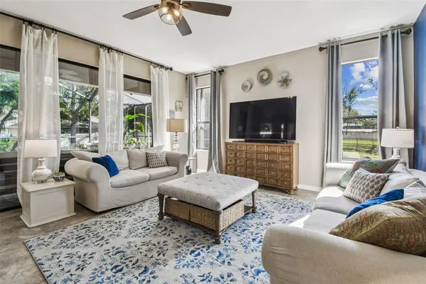 a living room with furniture and a fireplace