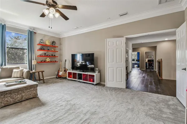 a view of a swimming pool with a patio and a yard