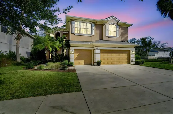 a view of hall way with furniture and stairs