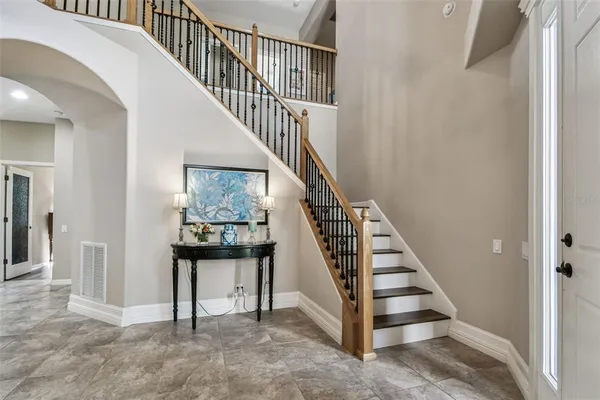 a living room with furniture and a clock