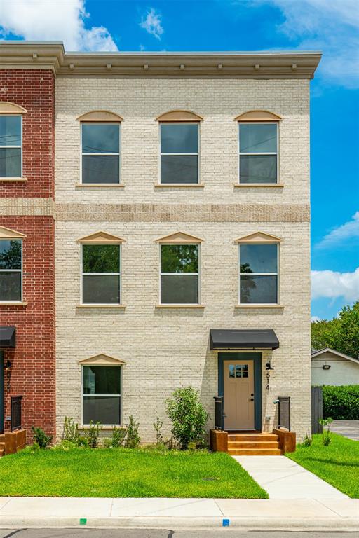 516 South O Connor Road Irving, TX 75060 - Photo 1 of 23 Three-story townhome featuring a cream brick facade with stone accents