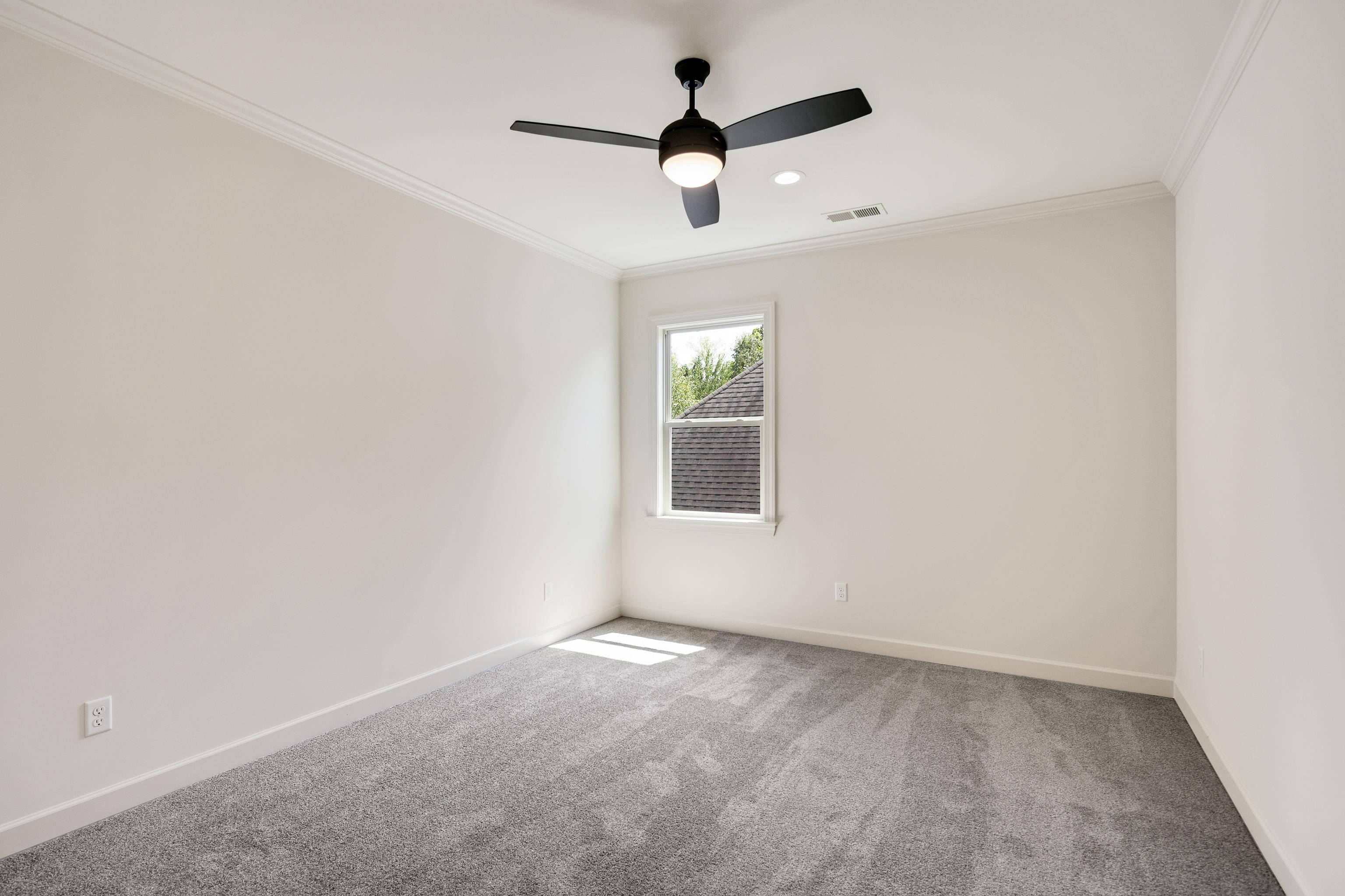 3406 Village Cross Loop Collierville, TN 38017 - Photo 32 of 40 Recessed lighting, ceiling fan, crown molding, double-pane window, and gray carpeting