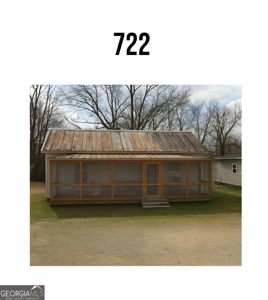 712 Searcy Avenue Griffin, GA 30223 - Photo 15 of 19 a black white and white house with a outdoor space