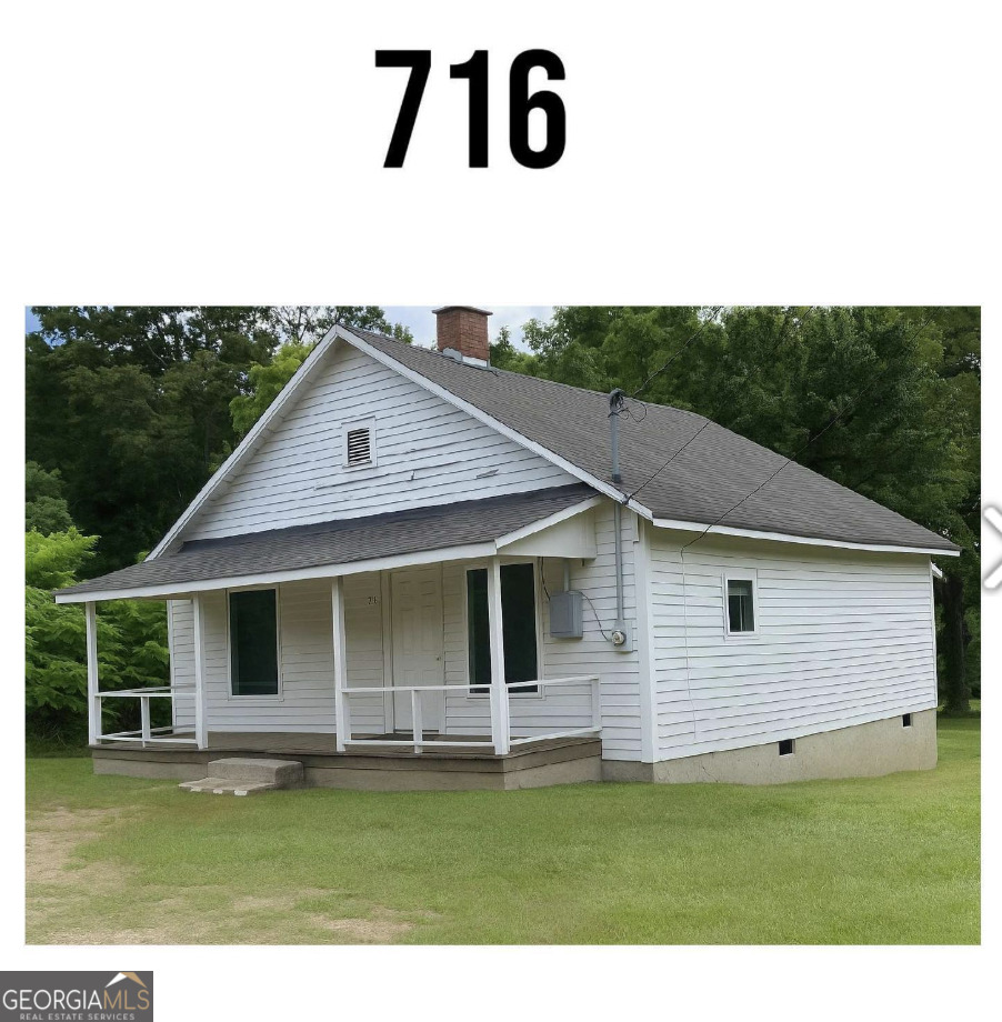 712 Searcy Avenue Griffin, GA 30223 - Photo 9 of 19 a view of a yard in front of a house with a large window
