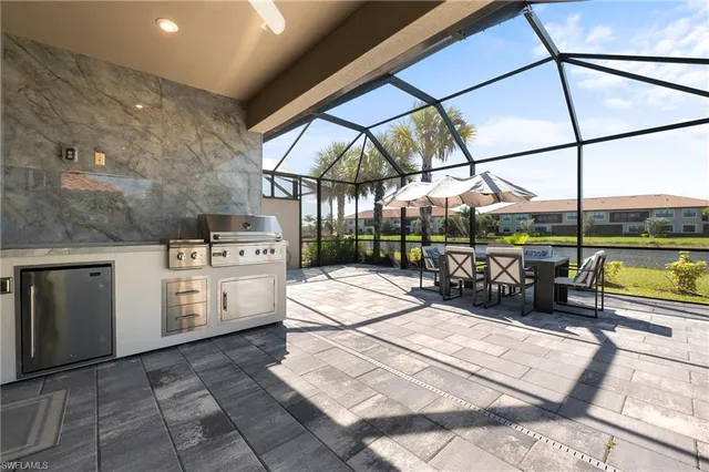 a kitchen with a sink a stove and cabinets