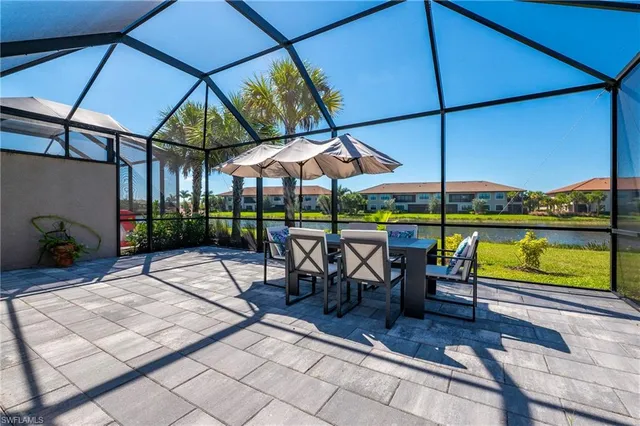 an outdoor space with furniture and umbrella