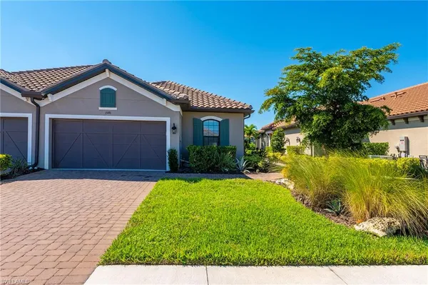 a front view of house with yard and green space