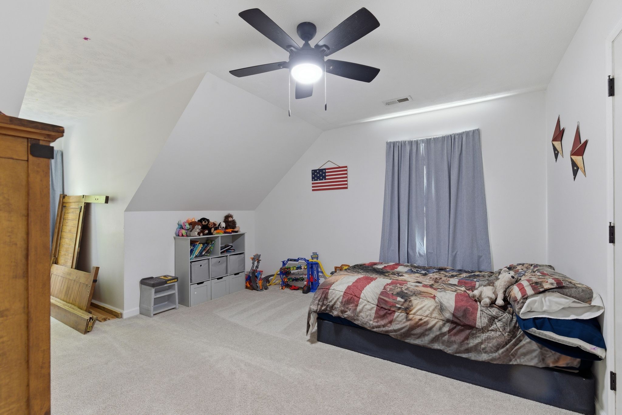 99 Smoke Rise Circle Manchester, TN 37355 - Photo 28 of 45 a bedroom with bed and a chandelier
