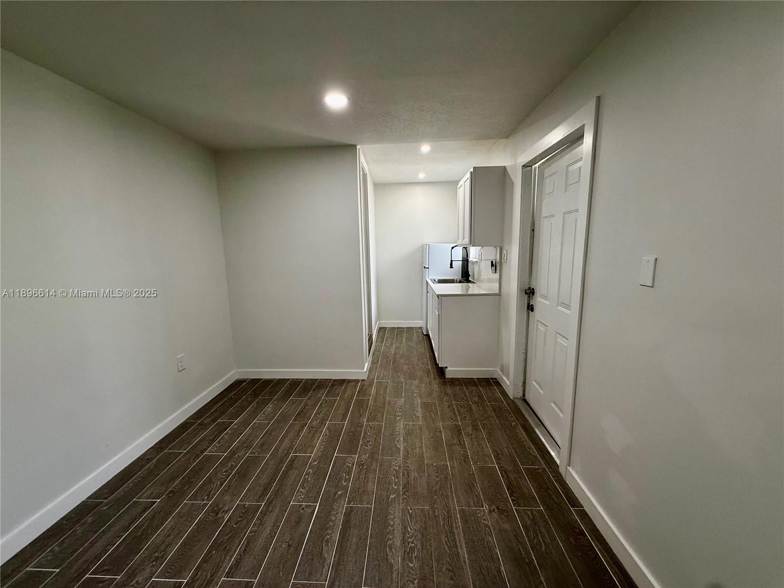 19800 Southwest 180th Avenue, Unit 154 Miami, FL 33187 - Photo 7 of 9 a view of a room with wooden floor
