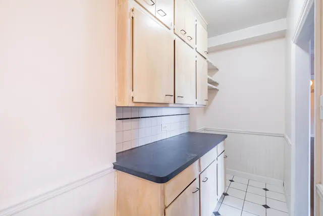 a kitchen with a sink and a refrigerator