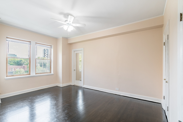 5000 South Cornell Avenue, Unit 3A Chicago, IL 60615 - Photo 7 of 14 a view of an empty room with wooden floor and a window