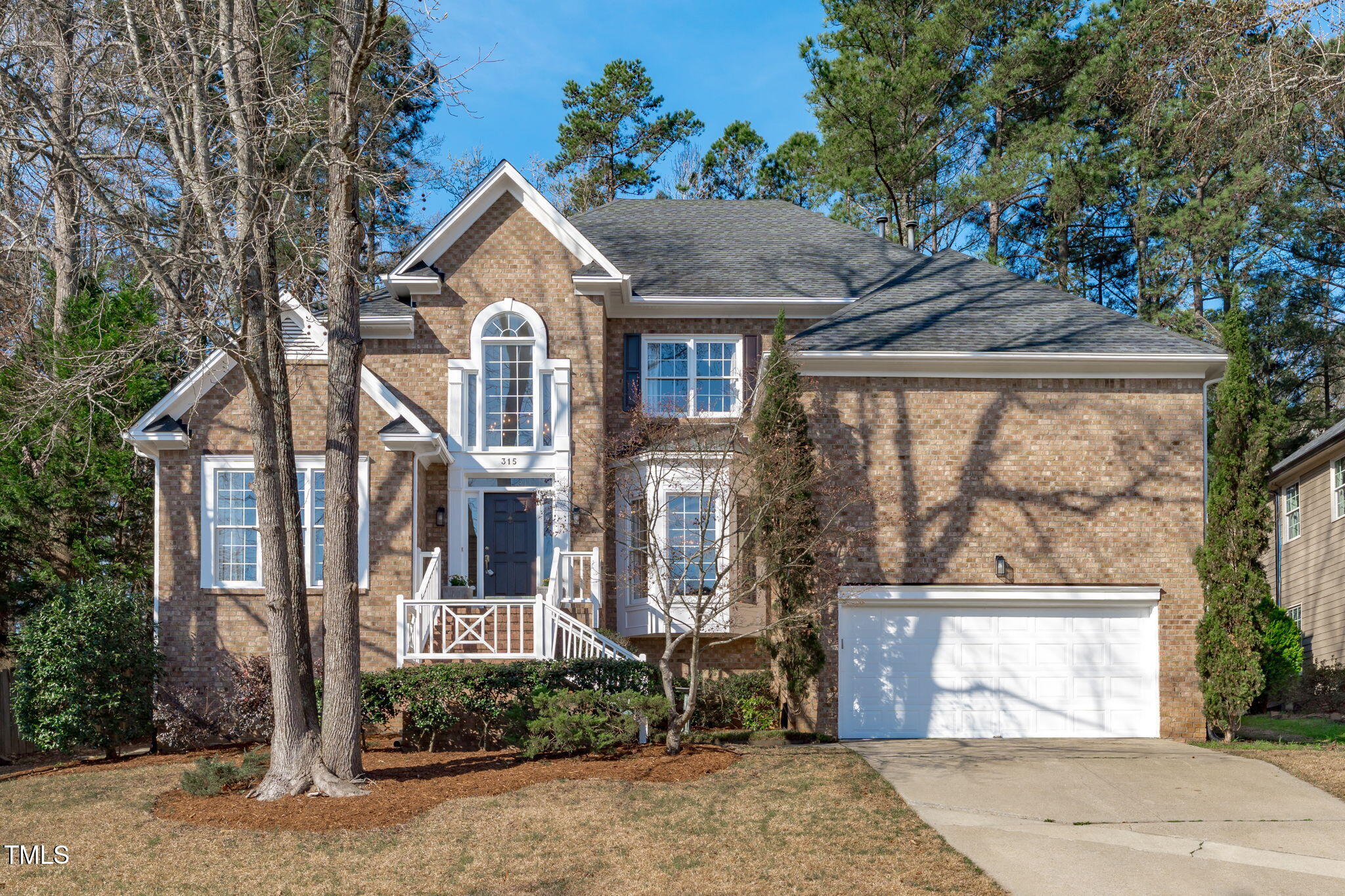 315 Barthel Drive Cary, NC 27513 - Photo 1 of 45 a front view of a house with a garden and plants