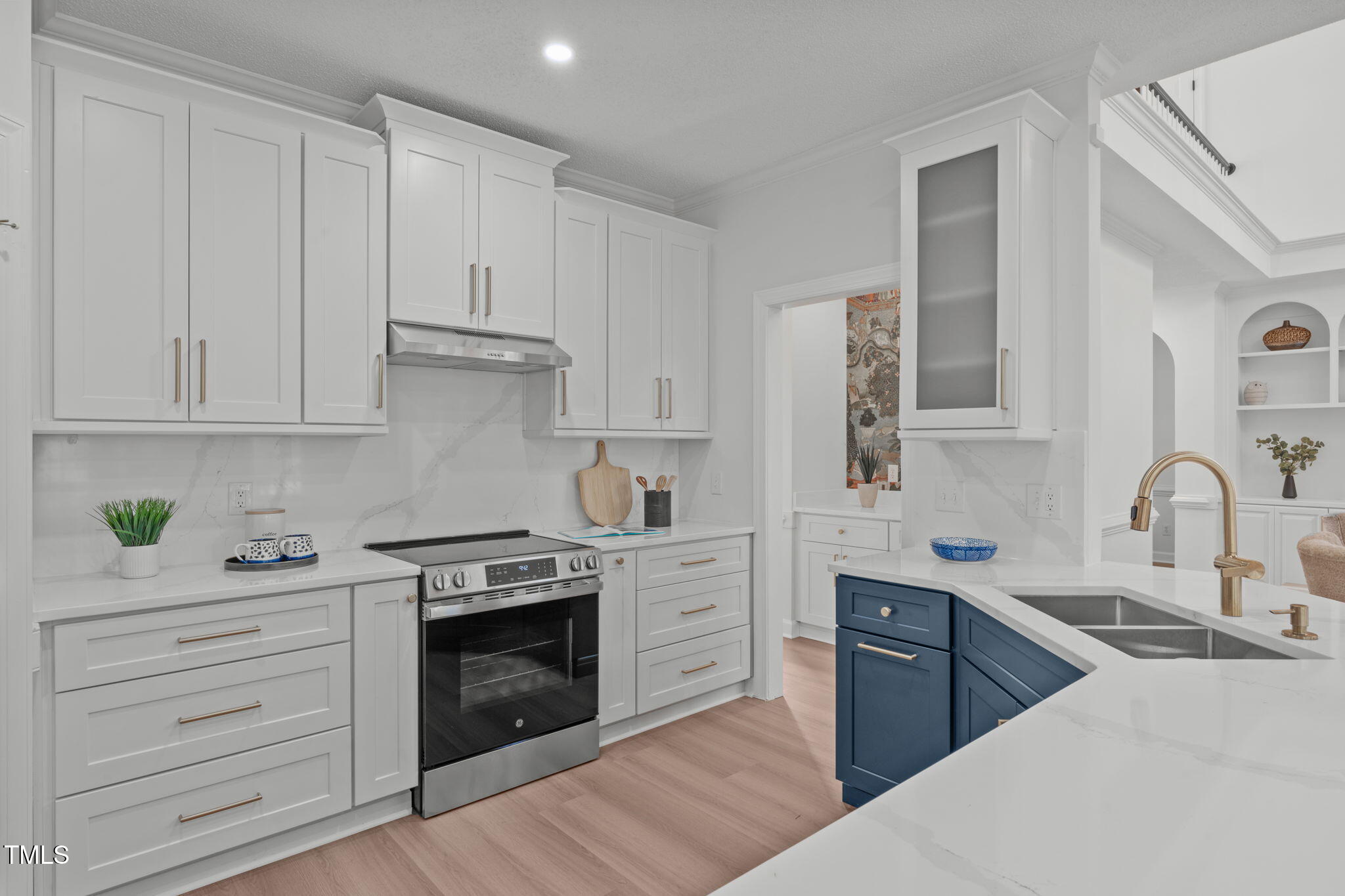315 Barthel Drive Cary, NC 27513 - Photo 10 of 45 a kitchen with stainless steel appliances granite countertop a stove and a sink