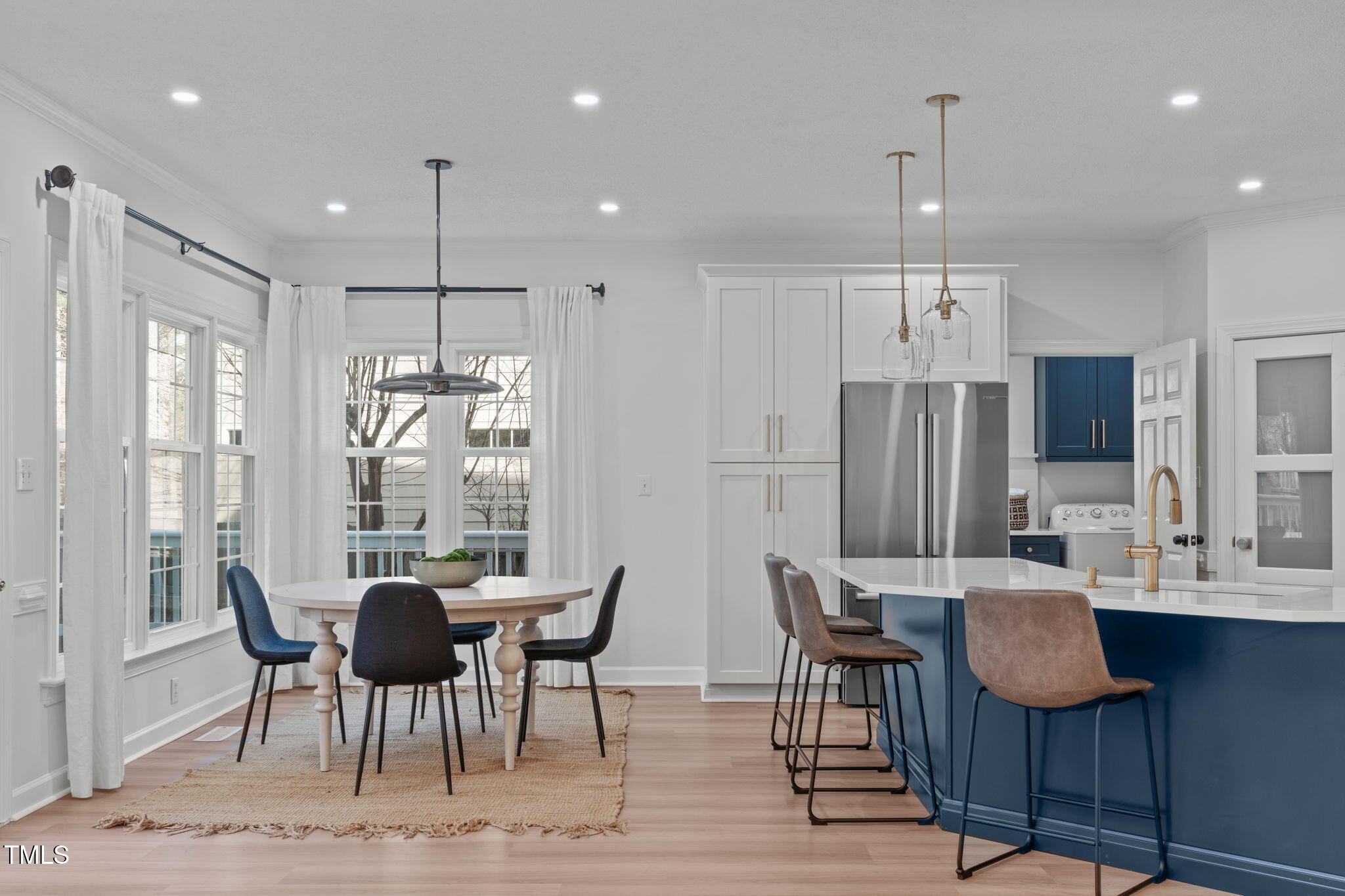 315 Barthel Drive Cary, NC 27513 - Photo 12 of 45 a view of a dining room with furniture a chandelier and wooden floor
