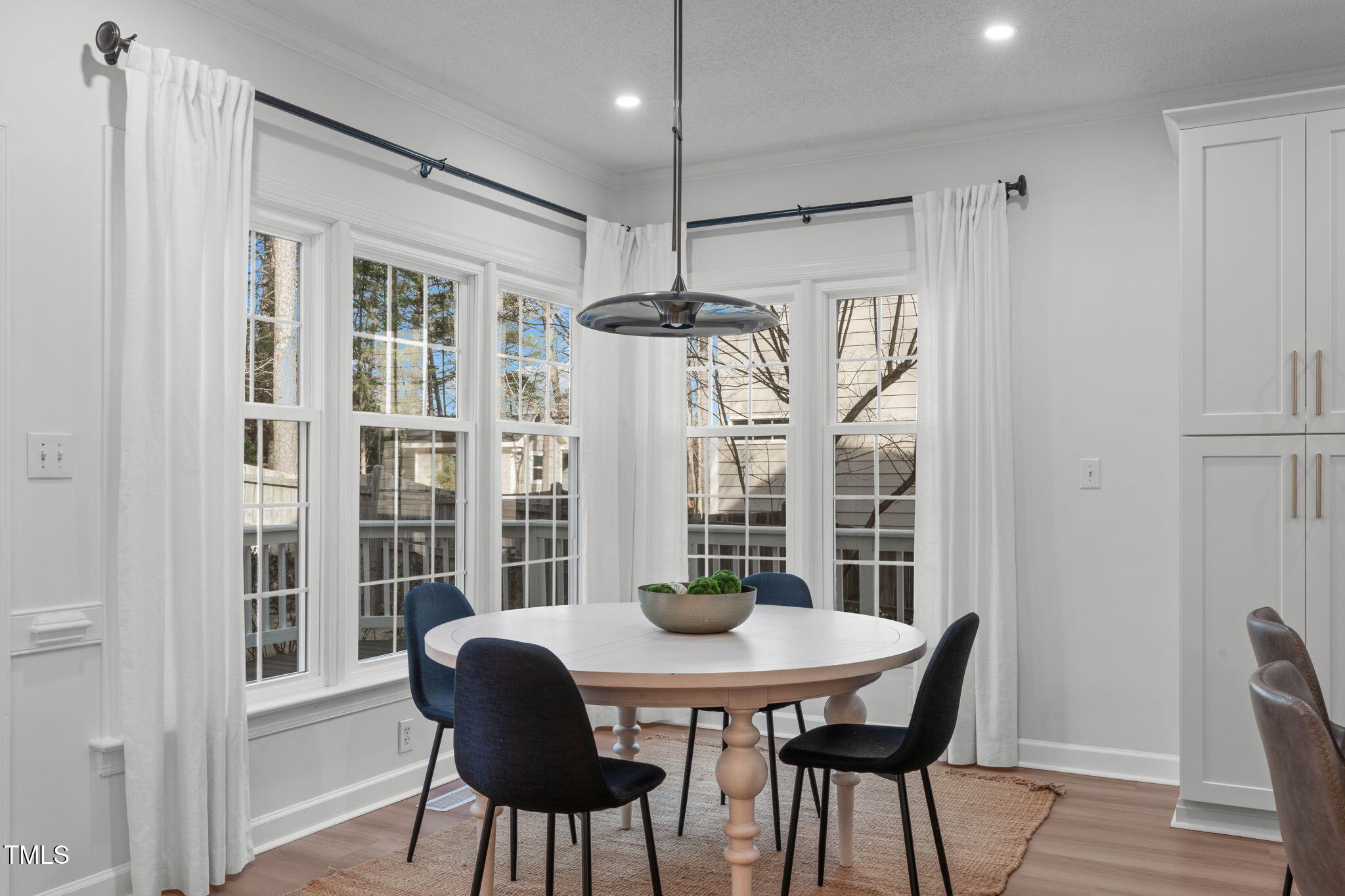 315 Barthel Drive Cary, NC 27513 - Photo 13 of 45 a view of a dining room with furniture window and wooden floor