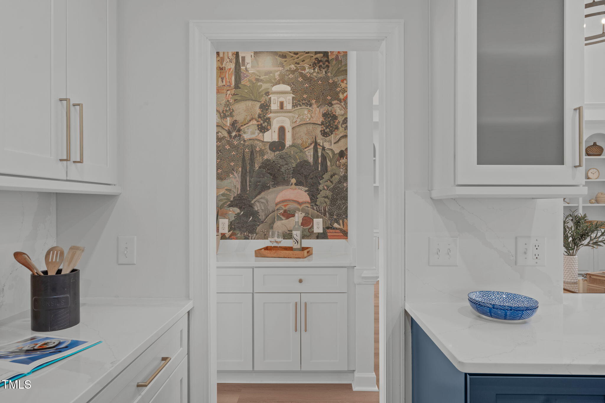 315 Barthel Drive Cary, NC 27513 - Photo 15 of 45 a kitchen with a wooden floor and cabinets