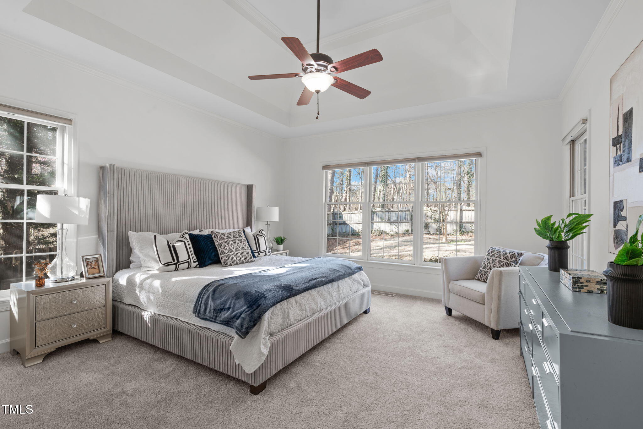 315 Barthel Drive Cary, NC 27513 - Photo 20 of 45 a spacious bedroom with a bed a couch and a potted plant