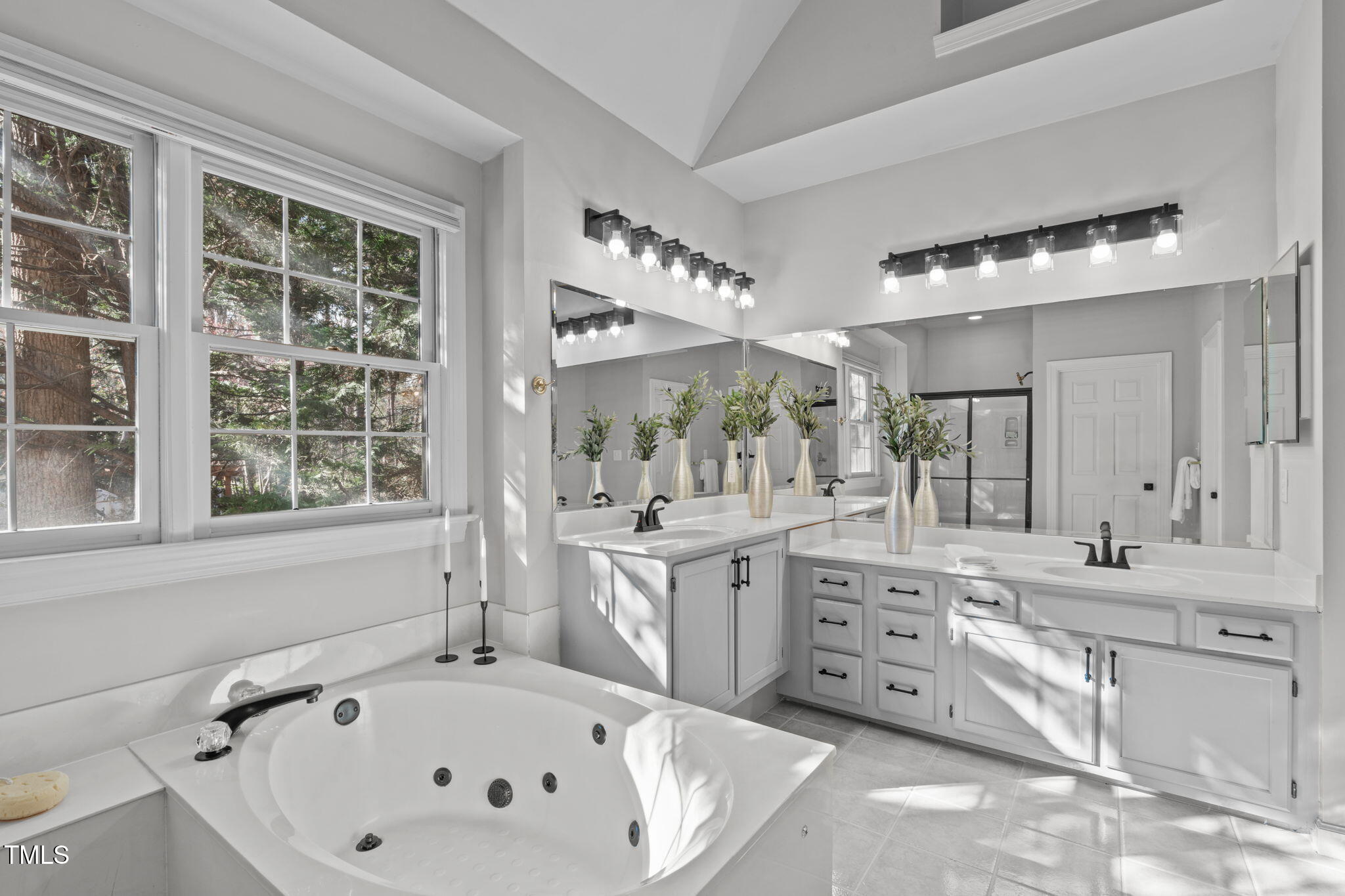 315 Barthel Drive Cary, NC 27513 - Photo 23 of 45 a bathroom with a bathtub sink and mirror