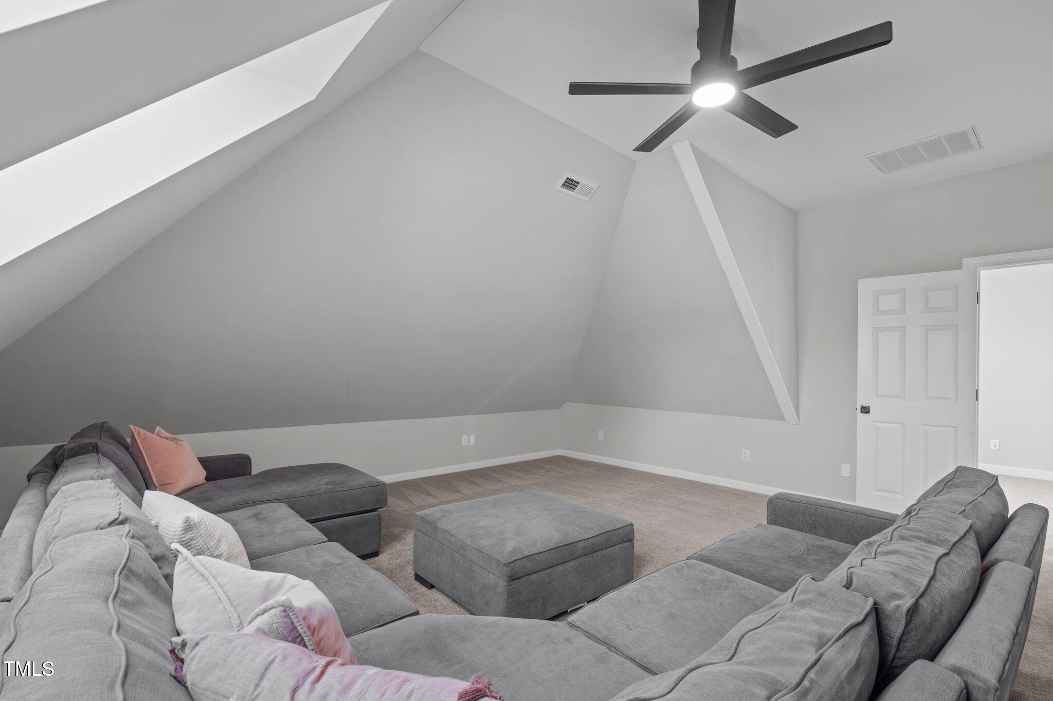 315 Barthel Drive Cary, NC 27513 - Photo 30 of 45 a living room with furniture and a ceiling fan