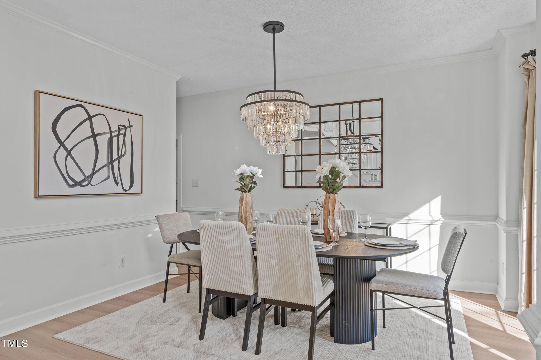 315 Barthel Drive Cary, NC 27513 - Photo 5 of 45 a view of a dining room with furniture wooden floor and chandelier