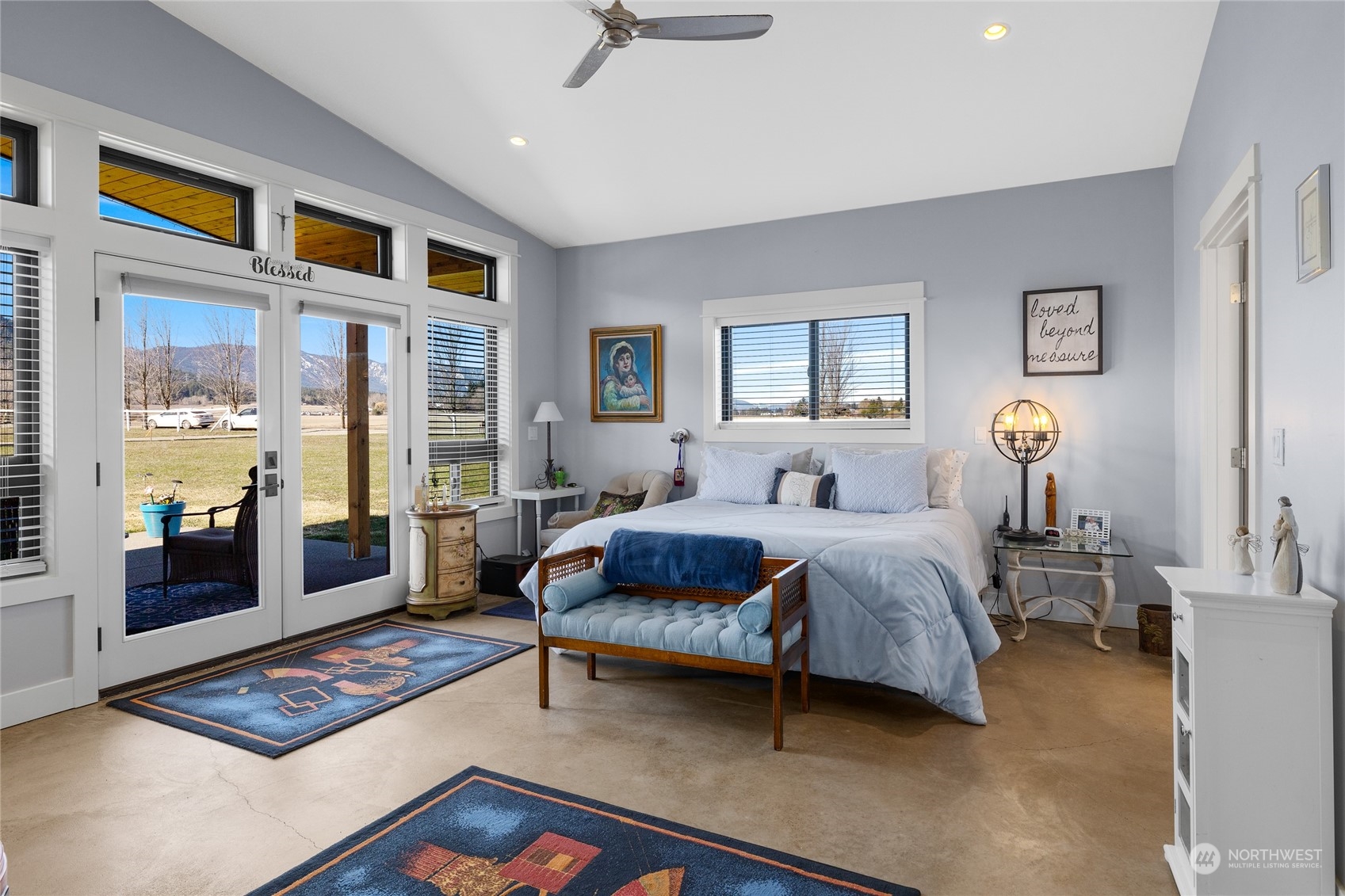 832 Pays Road Cle Elum, WA 98922 - Photo 13 of 25 a spacious bedroom with a bed and wooden floor