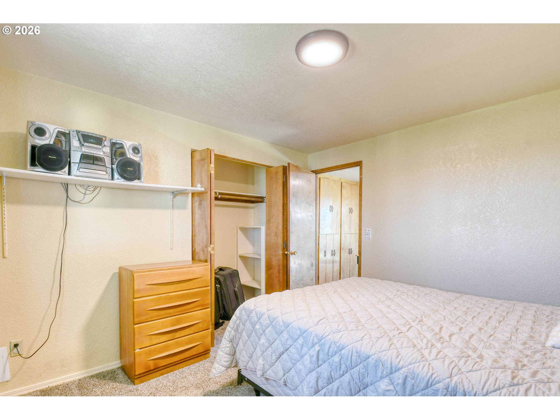 1107 Southwest 23rd Street Pendleton, OR 97801 - Photo 26 of 42 a bedroom with a bed and a window