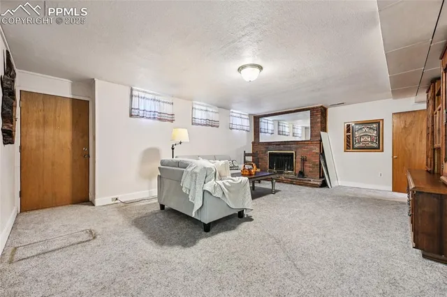 a view of a room that has a rug and a window