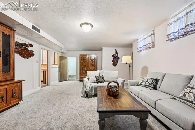 a kitchen with a sink cabinets and wooden floor
