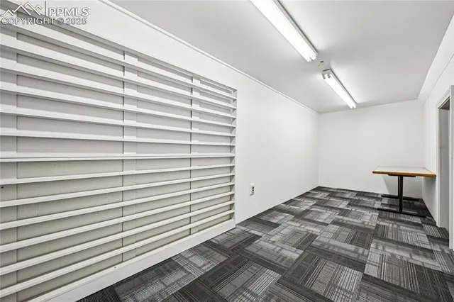a view of kitchen with cabinets