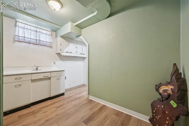 a view of a livingroom with furniture and windows