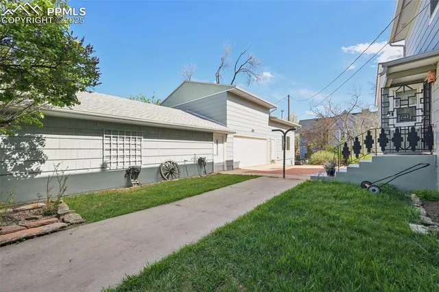 a living room with furniture a fireplace and a window