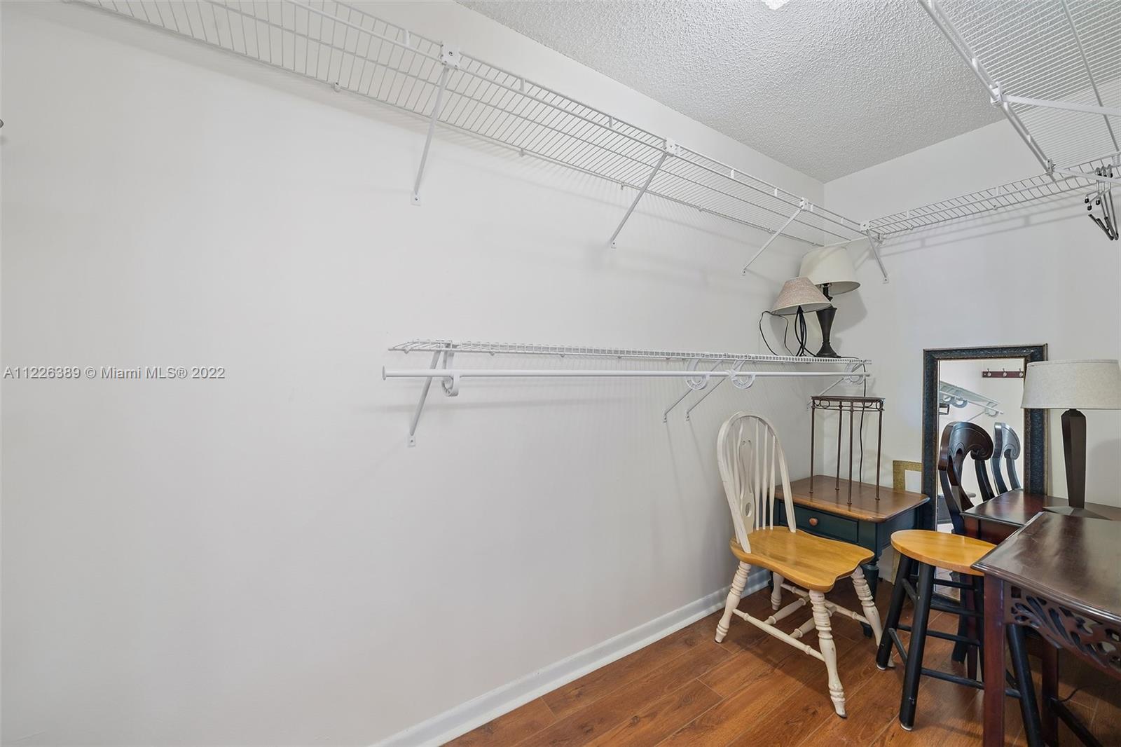 5335 Southeast Miles Grant Road, Unit 107 Stuart, FL 34997 - Photo 24 of 44 a view of a dining area with furniture