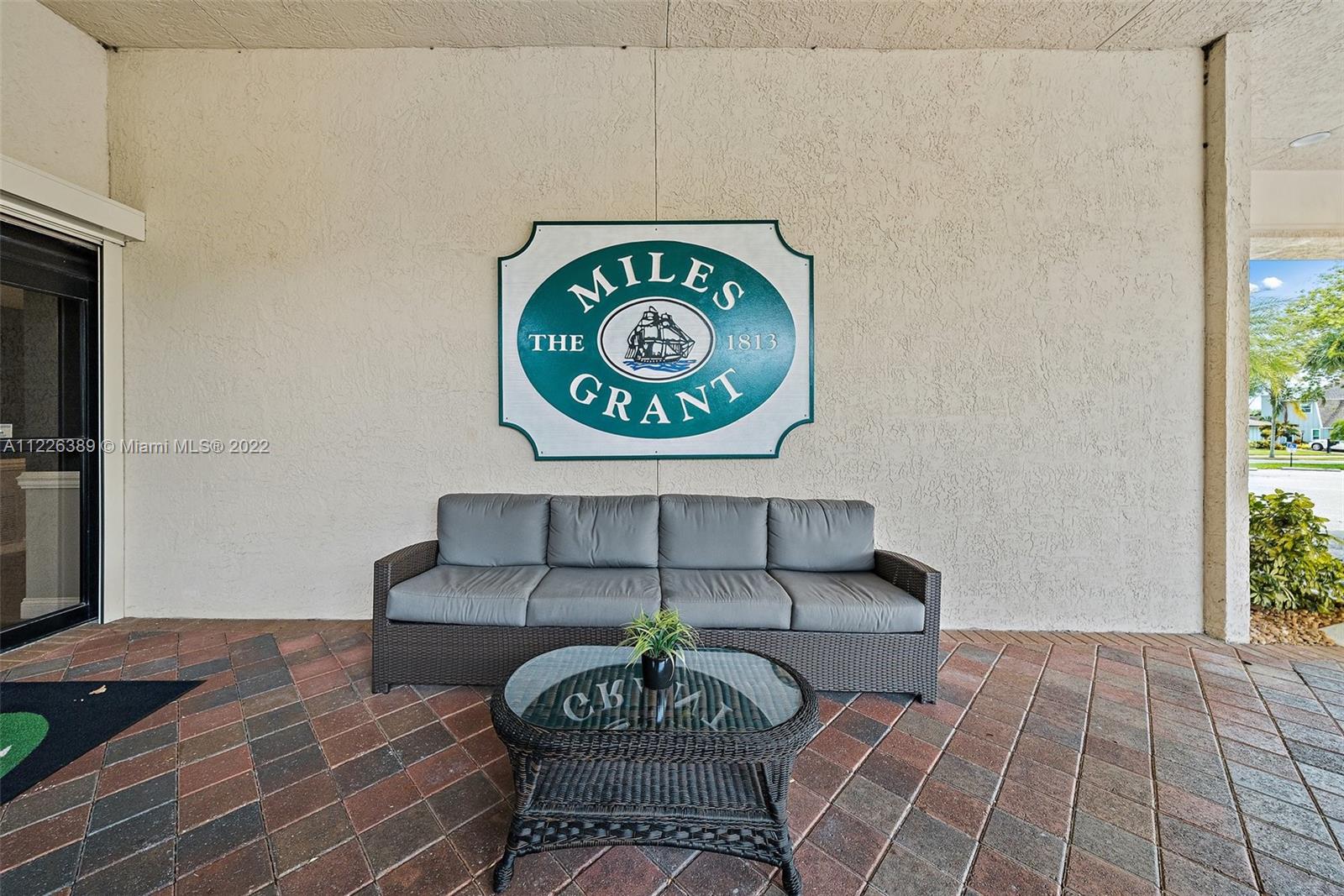 5335 Southeast Miles Grant Road, Unit 107 Stuart, FL 34997 - Photo 29 of 44 a view of a livingroom with furniture and rug