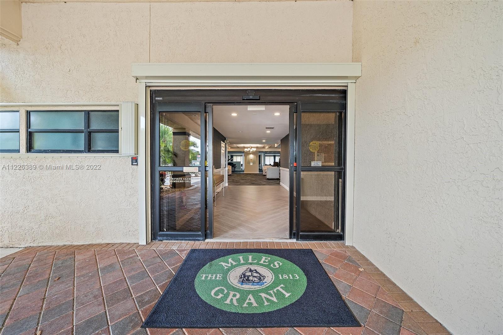5335 Southeast Miles Grant Road, Unit 107 Stuart, FL 34997 - Photo 30 of 44 an outdoor space with mirror