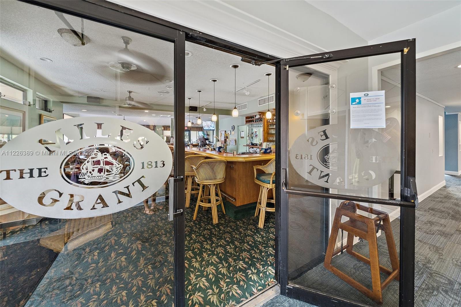 5335 Southeast Miles Grant Road, Unit 107 Stuart, FL 34997 - Photo 34 of 44 a view of a hallway with dining area