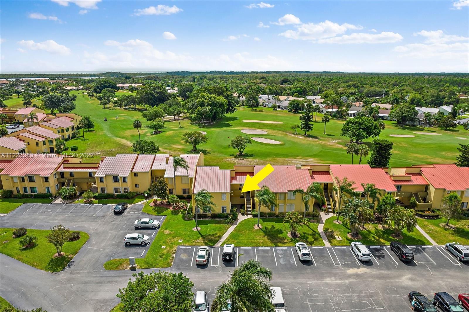 5335 Southeast Miles Grant Road, Unit 107 Stuart, FL 34997 - Photo 36 of 44 an aerial view of tennis court
