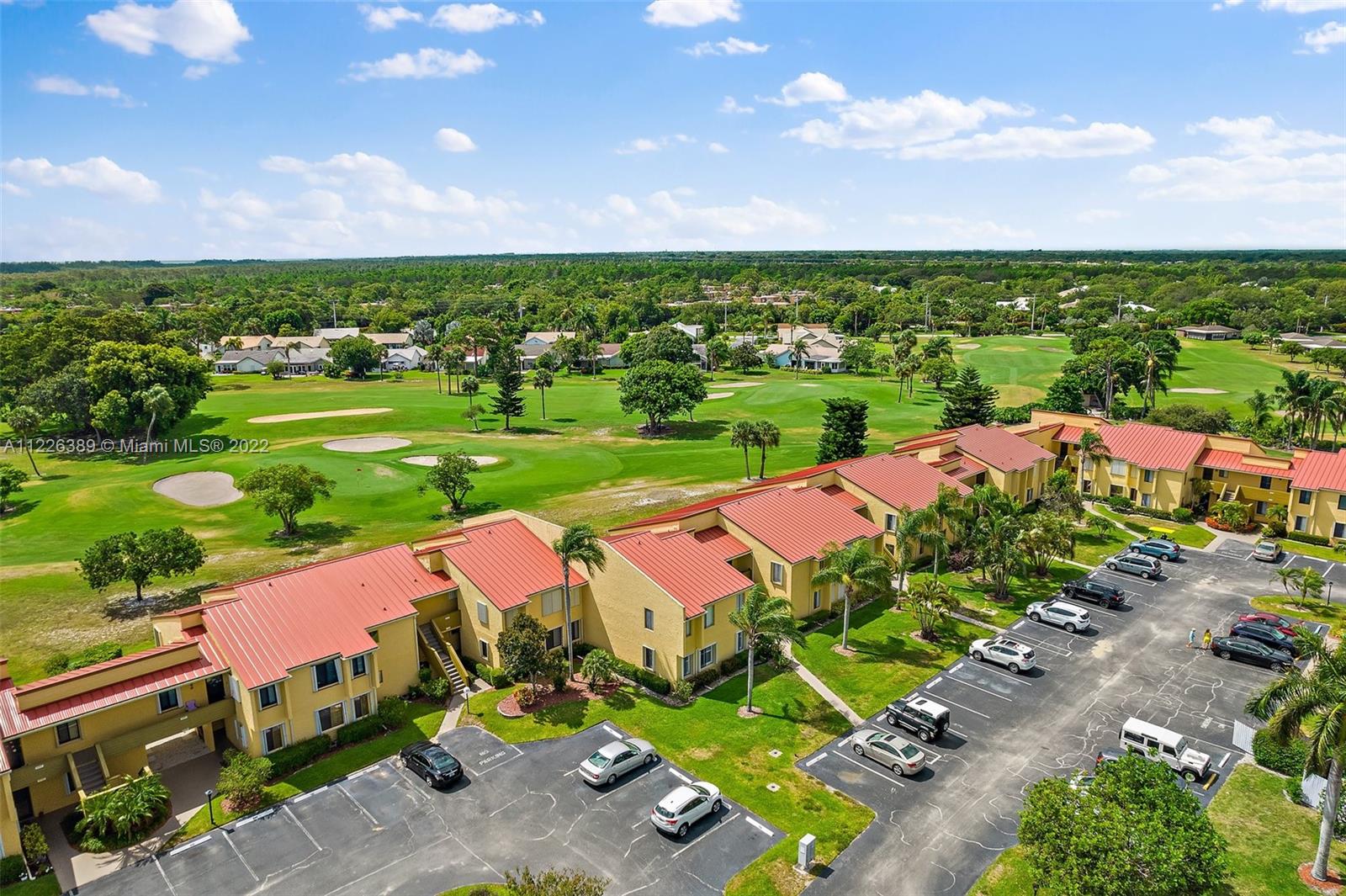 5335 Southeast Miles Grant Road, Unit 107 Stuart, FL 34997 - Photo 37 of 44 an aerial view of a house with a garden