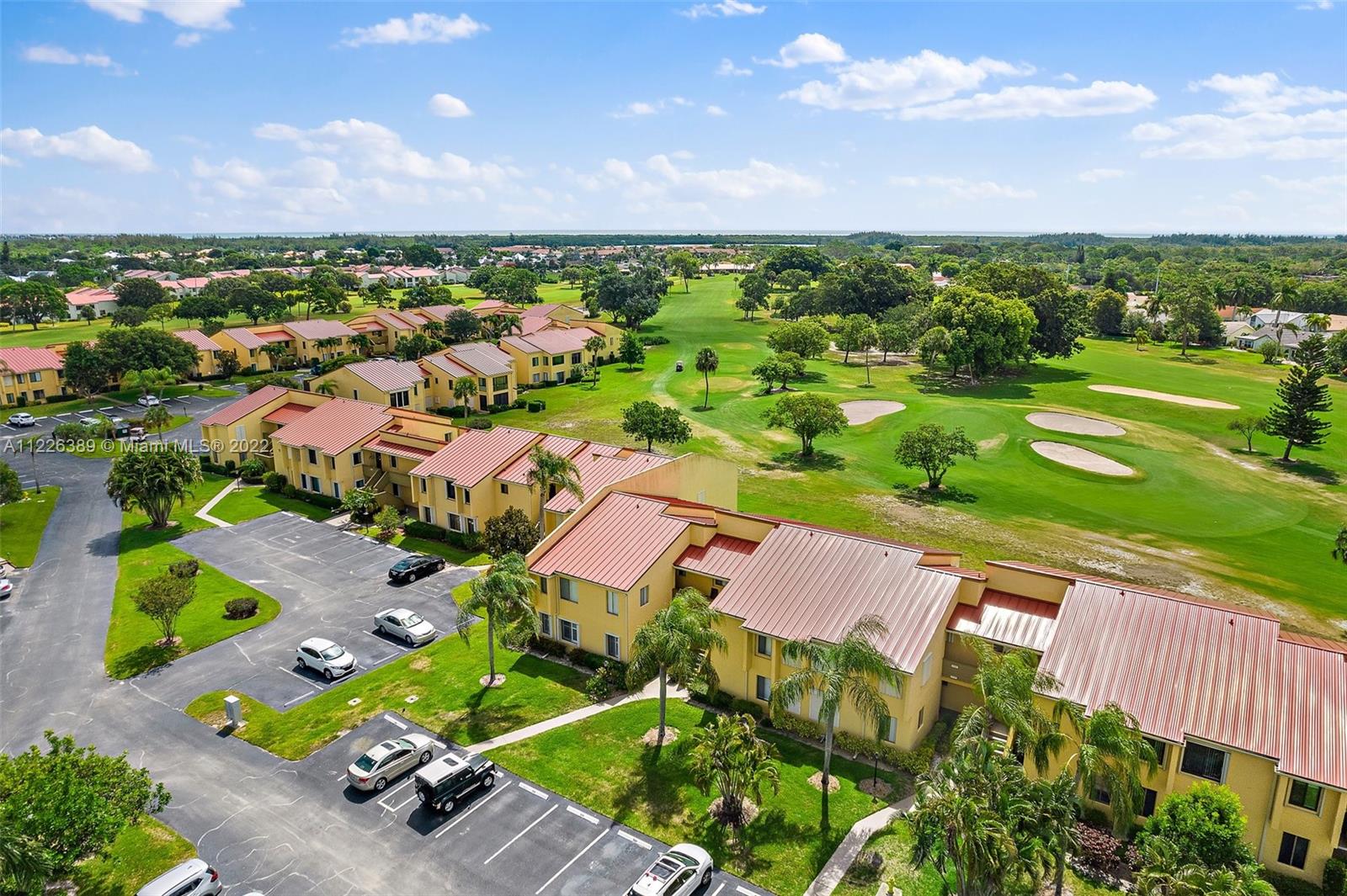 5335 Southeast Miles Grant Road, Unit 107 Stuart, FL 34997 - Photo 38 of 44 an aerial view of residential houses with outdoor space and street view
