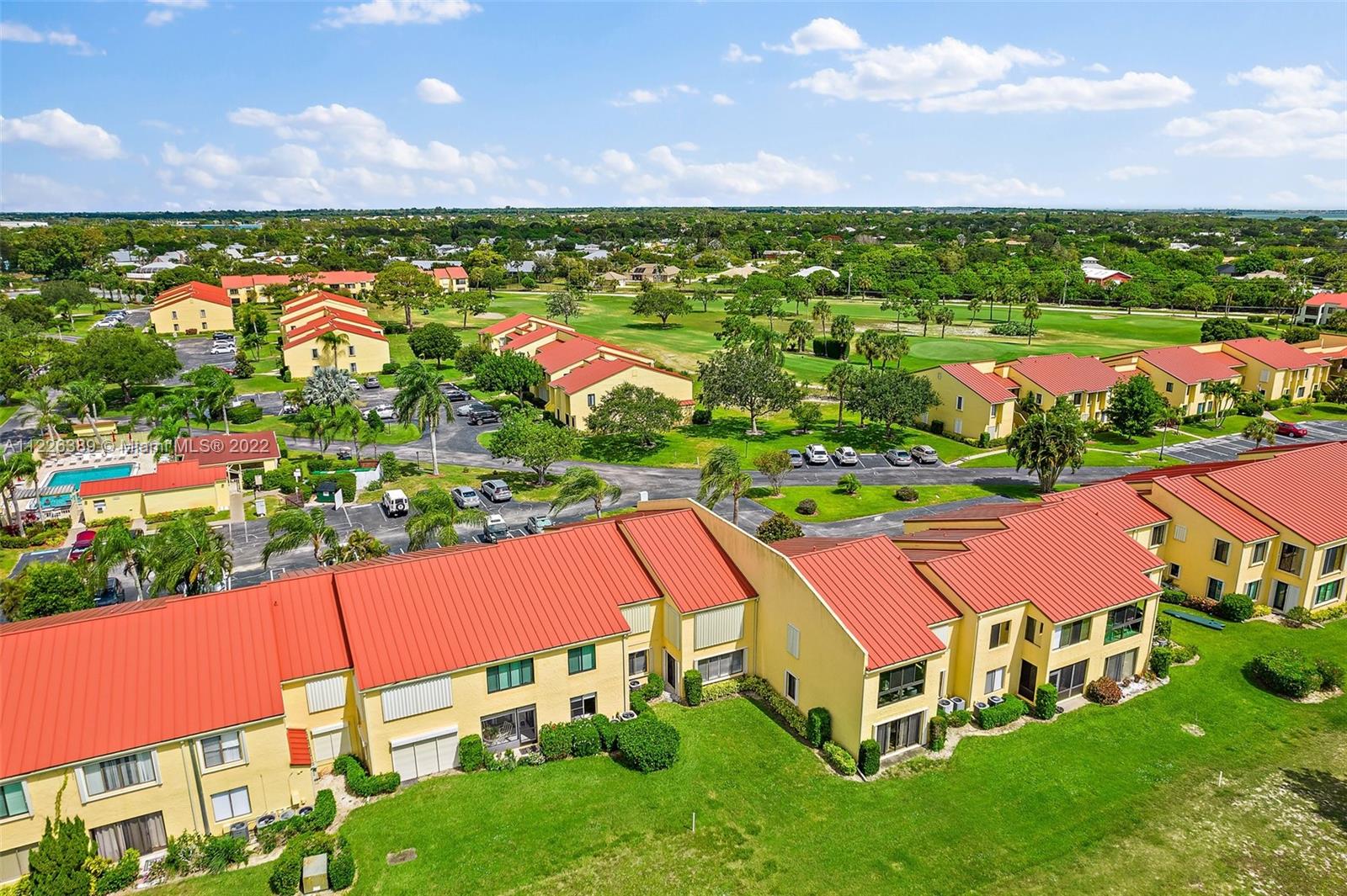 5335 Southeast Miles Grant Road, Unit 107 Stuart, FL 34997 - Photo 41 of 44 an aerial view of residential houses with outdoor space and street view