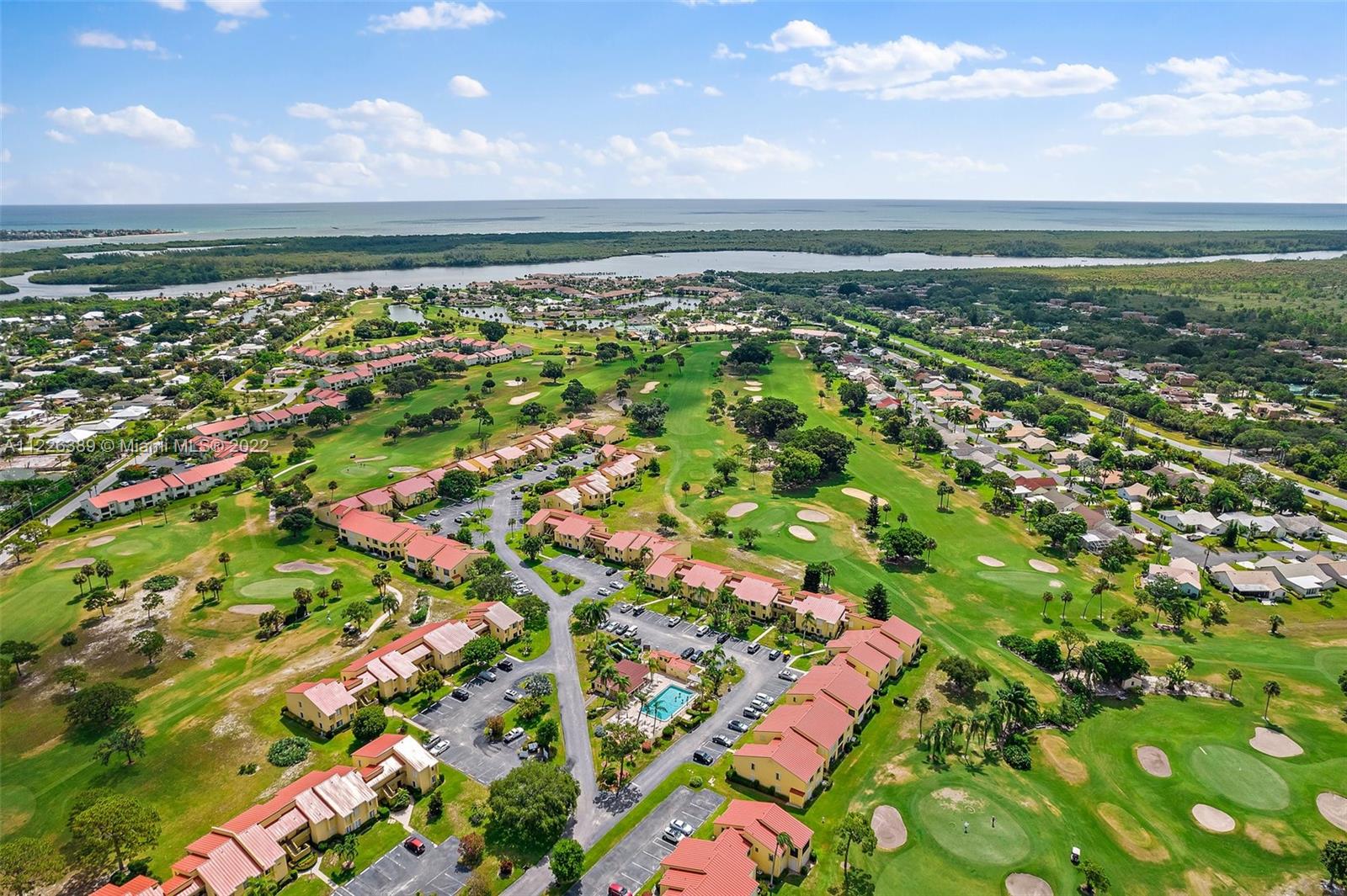 5335 Southeast Miles Grant Road, Unit 107 Stuart, FL 34997 - Photo 44 of 44 an aerial view of residential building with outdoor space