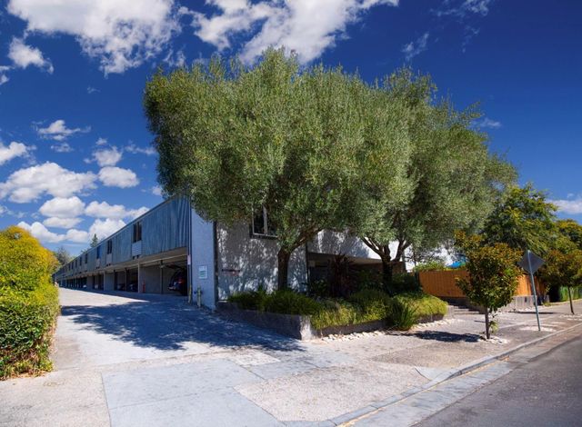a view of a house with a street