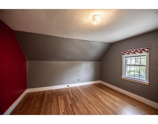 10 Putnam Road Ipswich, MA 01938 - Photo 13 of 19 a view of an empty room with wooden floor and a window