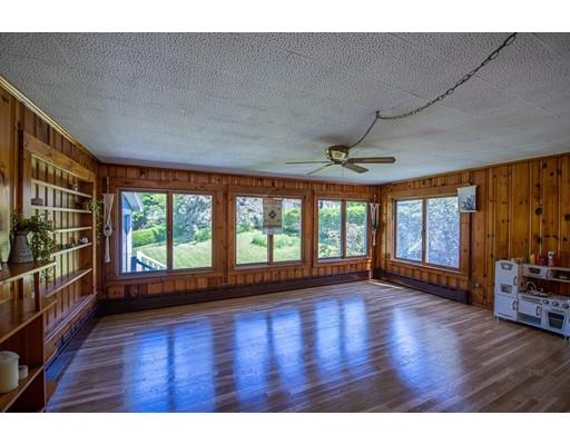 10 Putnam Road Ipswich, MA 01938 - Photo 5 of 19 a view of empty room with wooden floor and fan