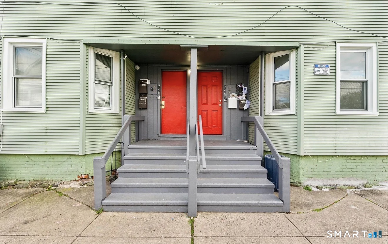 746 Maple Street Bridgeport, CT 06608 - Photo 11 of 12 a view of a house with entrance and stairs