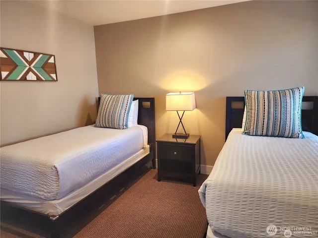 a bed room with a bed and a night stand