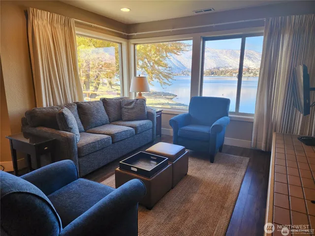 a living room with furniture and a large window