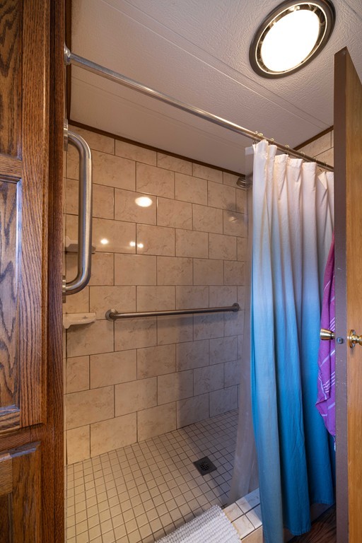 26 Gould Road Ware, MA 01082 - Photo 15 of 23 a bathroom with a shower and a mirror